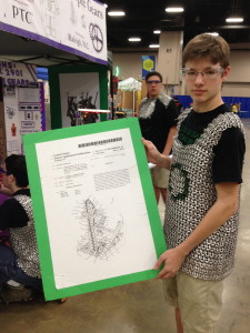 Sean McDonald, member of the Purple Gear team from North Carolina, holding up one of the team's patents