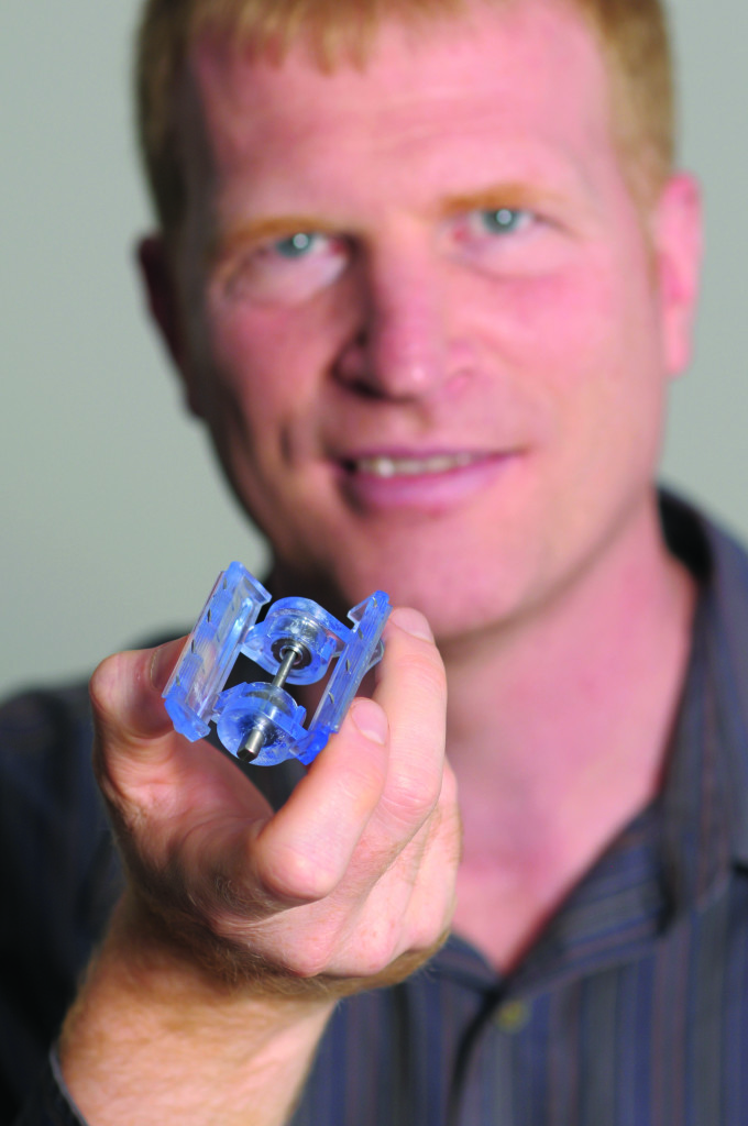 Dr. Dennis Filips holding the ITClamp, photo courtesy of iTraumaCare