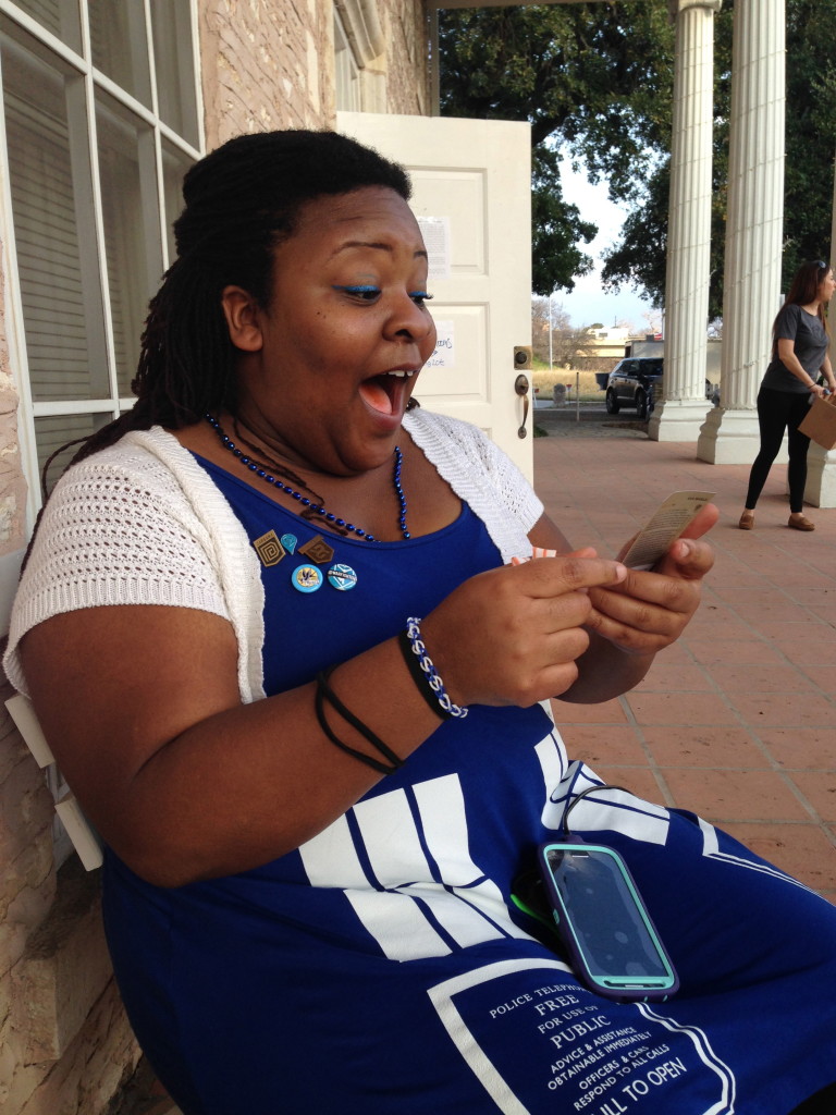 Amanda Saunders from Houston reacts to getting a rare card  in  the Ingress game 