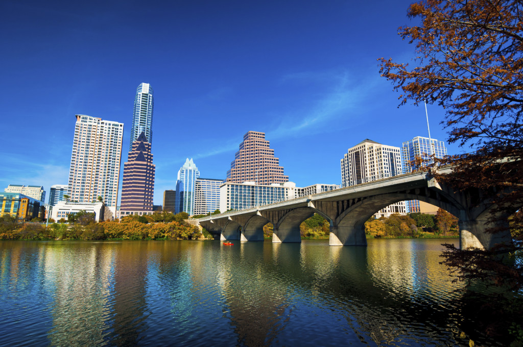 Austin downtown skyline, bridge, lake, and fall trees