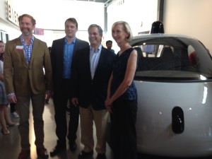 Troy Livingston, CEO, The Thinkery, Chris Urmson, Director, Google Self-Driving Car Project, Austin Mayor Steve Adler and City Councilwoman Ann Kitchen in front of the Google autonomous car prototype