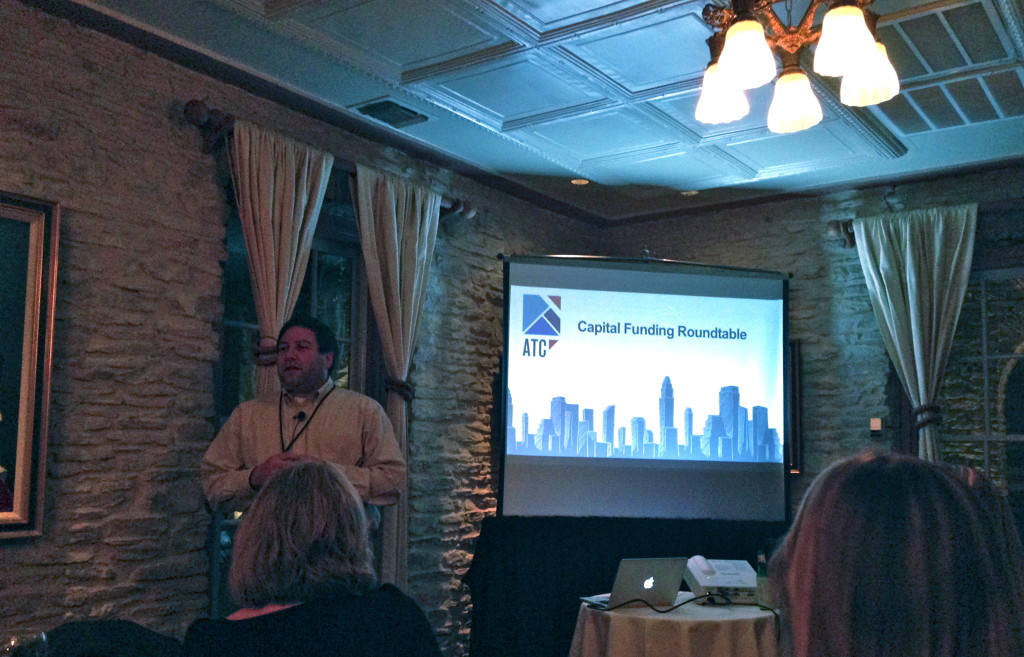 David Altounian presenting data on funding deals in Austin. 