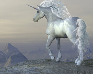 A white unicorn stallion looks over his vast territory from a mountain cliff.