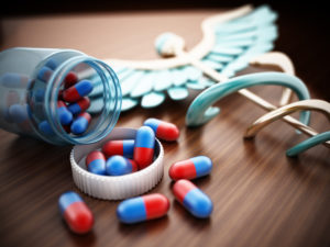 Pills on wooden table